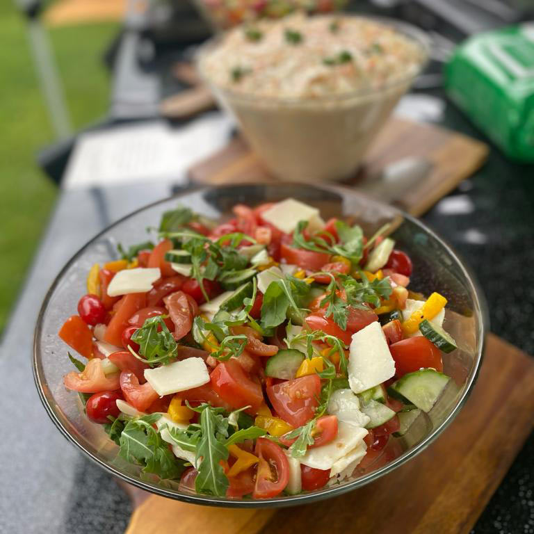 Crunchy Salads with parmesan shavings and dressings at Hog Roast event